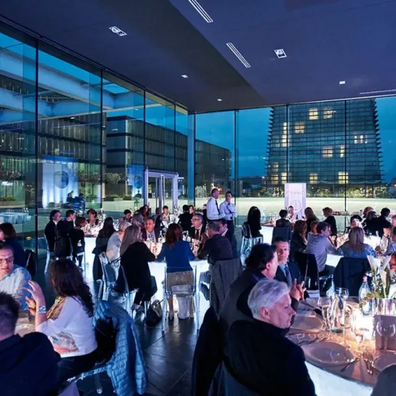 people at a table during an event at the kube